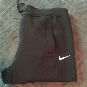 High-waisted Nike sweatpants.